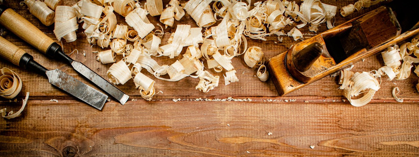 Master woodworking tools with shavings on authentic wooden surface